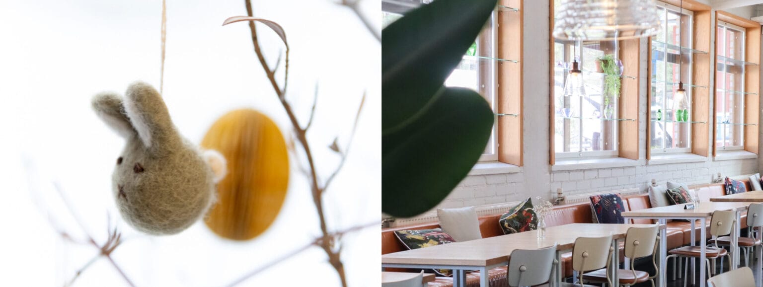 Huovutettu pupu koriste oksalla ja valoisa kahvila.