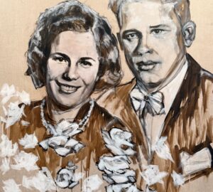 Muotokuva hymyilevästä pariskunnasta maalattuna kankaalle.