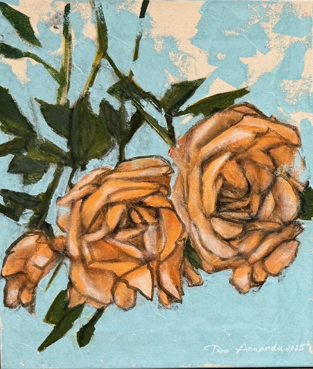 Kaksi oranssia ruusua sinisellä taustalla