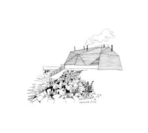 Kaksi ihmistä kivillä merenrannalla, rakennus taustalla.