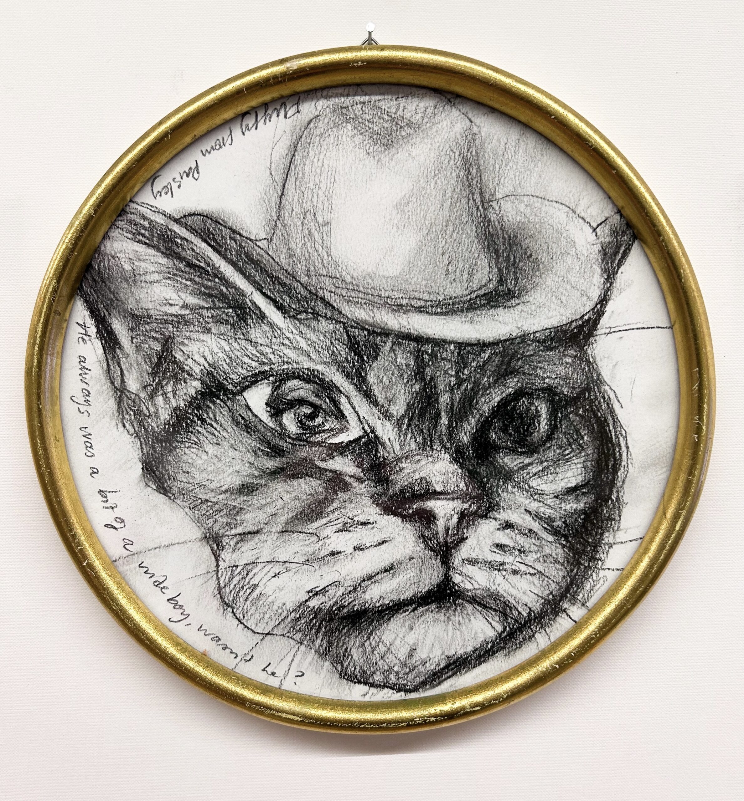 Piirros kissasta cowboy-hatussa kehyksissä