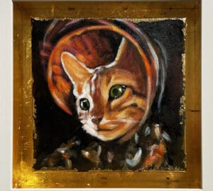 Kultareunuksinen kissa-aiheinen taideteos