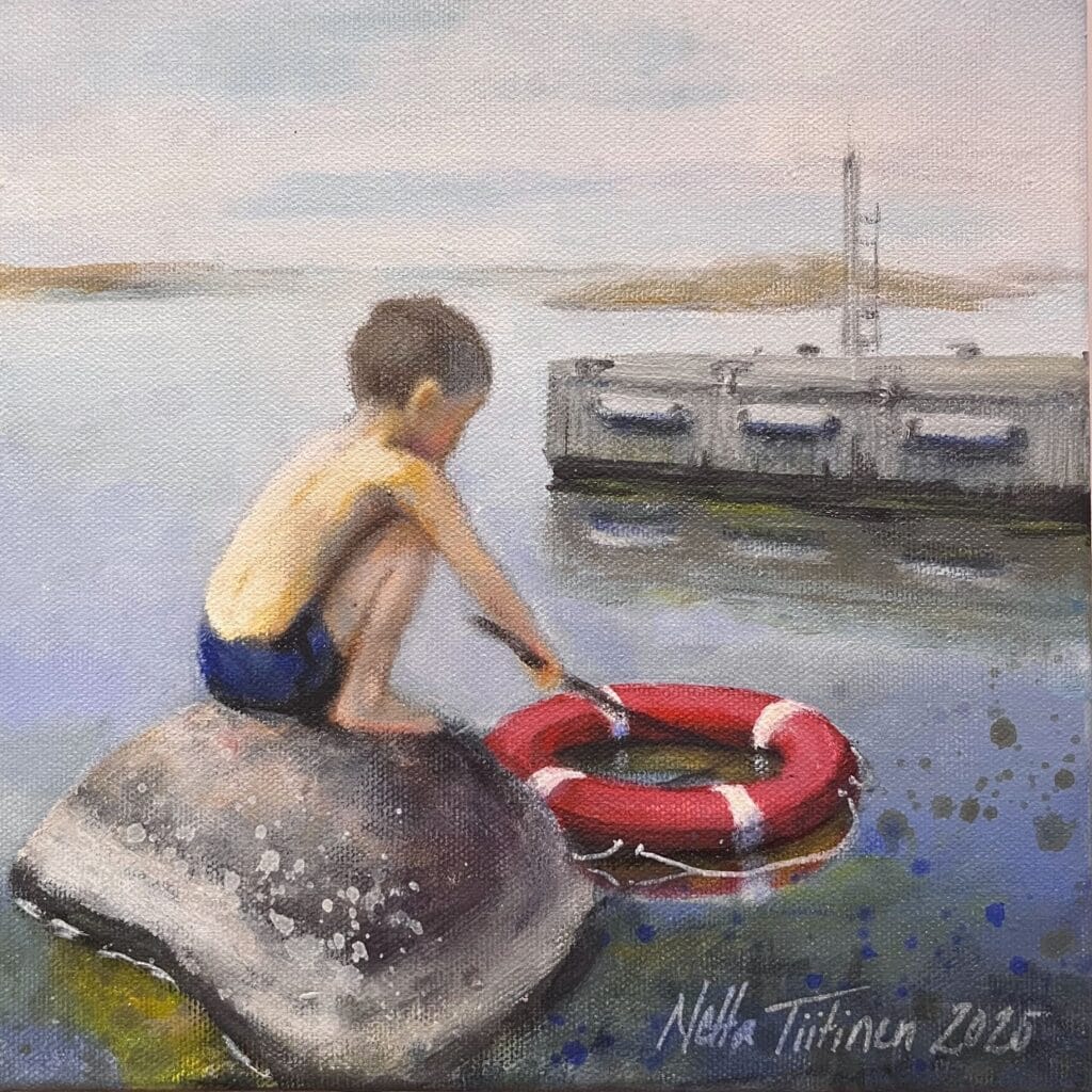 Poika kivellä ja pelastusrengas vedessä