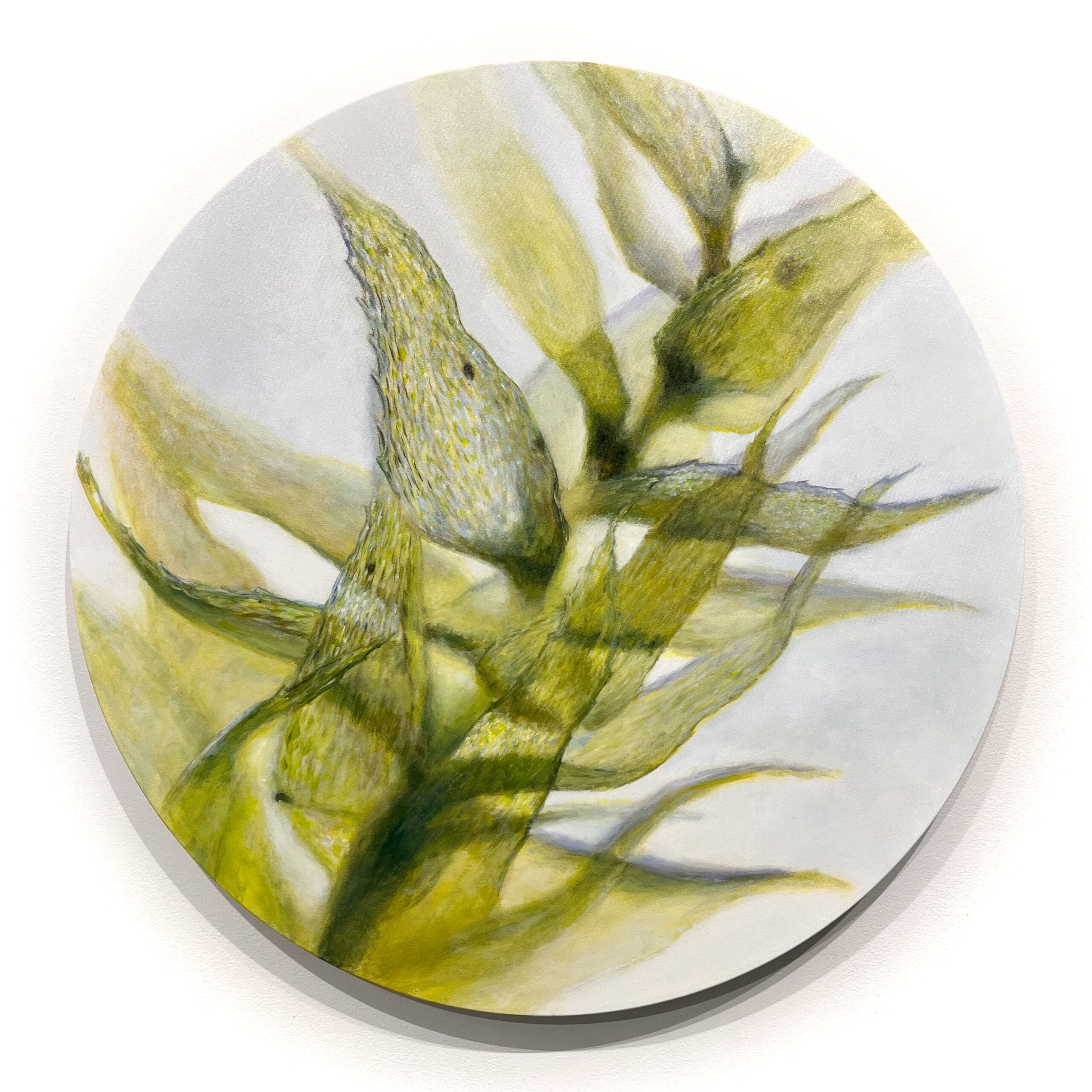 Abstrakti maalaus keltaisista ja vihreistä lehdistä