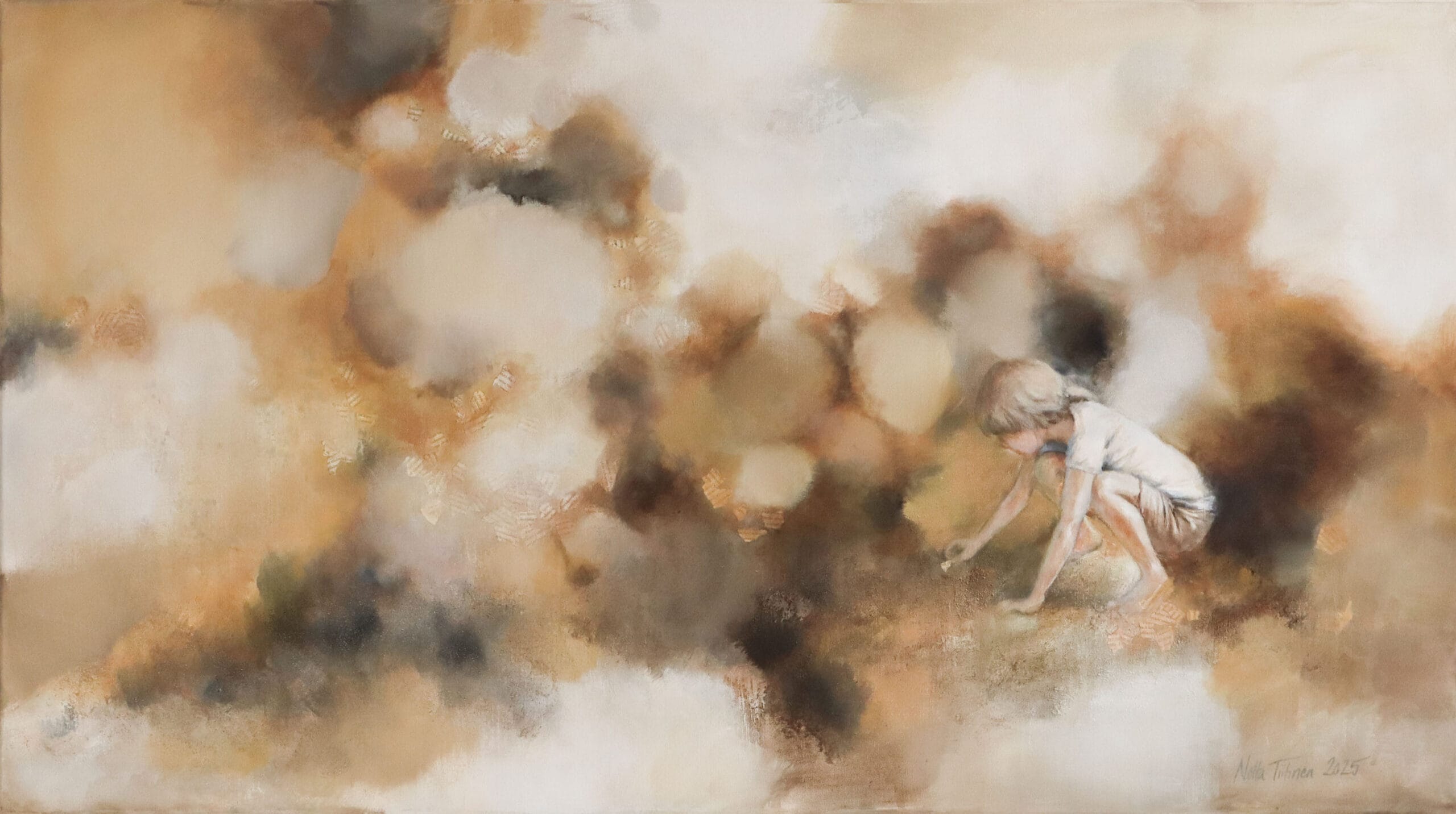 Lapsi leikkii maassa abstraktein värein