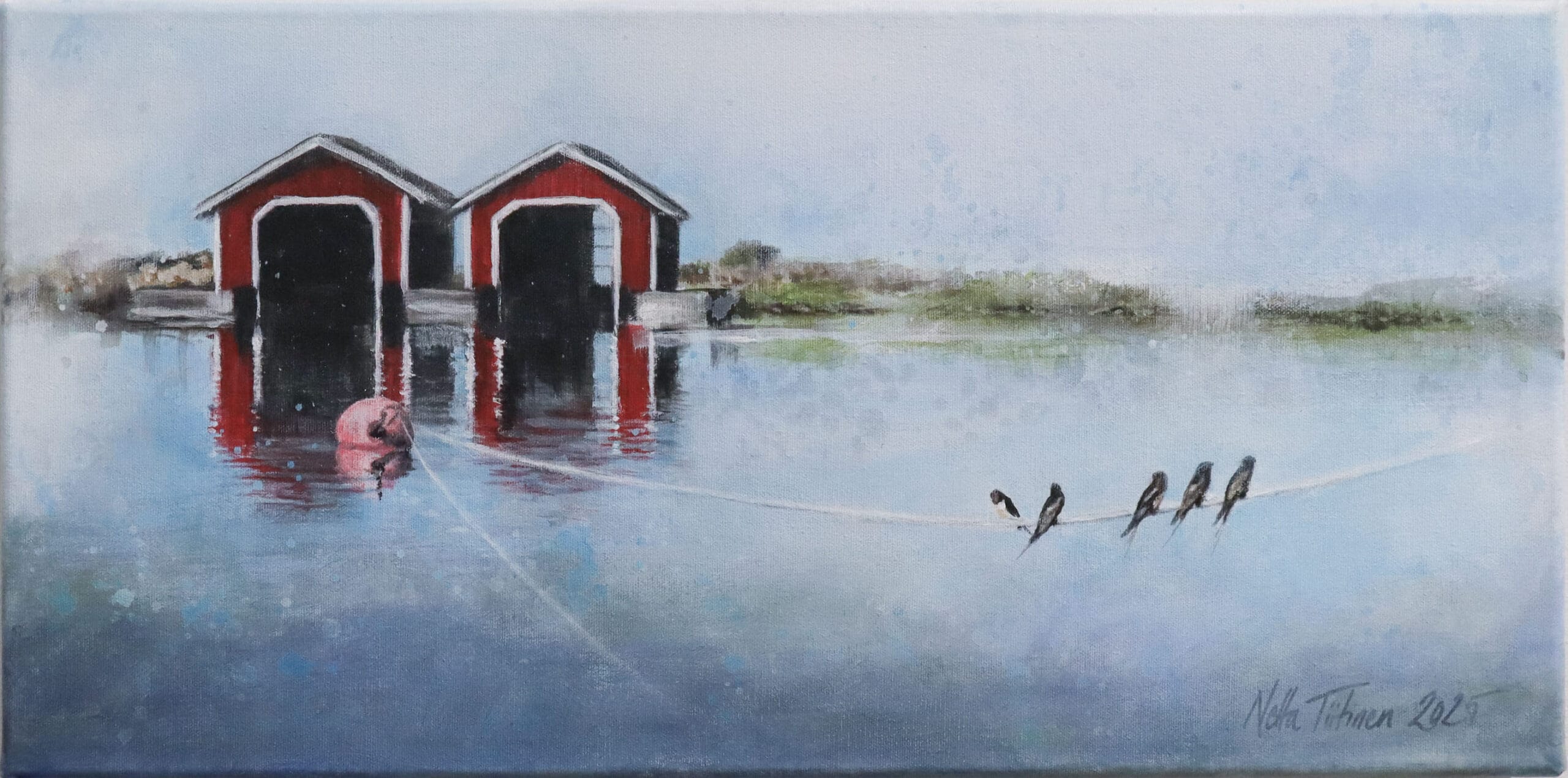 Punaiset venevajat veden äärellä